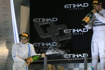 World © Octane Photographic Ltd. Sunday 23rd November 2014. Abu Dhabi Grand Prix - Yas Marina Circuit - Formula 1 Podium. Mercedes AMG Petronas – Lewis Hamilton - Race winner and 2014 World Champion. Digital Ref: 1173LB1DX7599