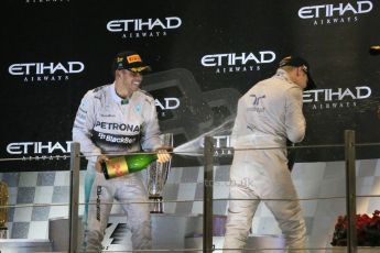World © Octane Photographic Ltd. Sunday 23rd November 2014. Abu Dhabi Grand Prix - Yas Marina Circuit - Formula 1 Podium. Mercedes AMG Petronas – Lewis Hamilton - Race winner and 2014 World Champion. Digital Ref: 1173LB1DX7635