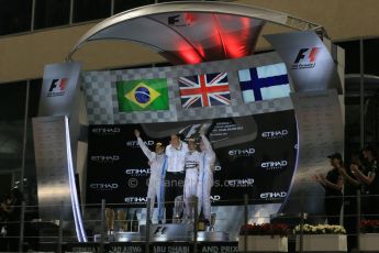World © Octane Photographic Ltd. Sunday 23rd November 2014. Abu Dhabi Grand Prix - Yas Marina Circuit - Formula 1 Podium. Mercedes AMG Petronas – Toto Wolff and Lewis Hamilton - Race winner and 2014 World Champion and Williams Racing - Felipe Massa (2nd) and Valtteri Bottas (3rd). Digital Ref: 1173LB1DX7726