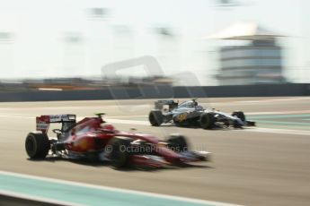 World © Octane Photographic Ltd. Saturday 22nd November 2014. Abu Dhabi Grand Prix - Formula 1 Practice 3. McLaren Mercedes MP4/29 – Kevin Magnussen and Scuderia Ferrari F14T – Kimi Raikkonen. Digital Ref: 1165CB1D8017