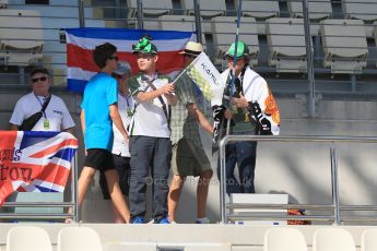 World © Octane Photographic Ltd. Saturday 22nd November 2014. Abu Dhabi Grand Prix - Formula 1 Practice 3. Kamui Kobayashi/Caterham fans. Digital Ref: 1165LB1D0513