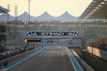 World © Octane Photographic Ltd. Saturday 22nd November 2014. Abu Dhabi Grand Prix - Yas Marina Circuit - Formula 1 Qualifying. 1st corner at Sunset Digital Ref: 1166LB1D0722