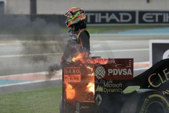 World © Octane Photographic Ltd. Sunday 23rd November 2014. Abu Dhabi Grand Prix - Yas Marina Circuit - Formula 1 Race. Lotus F1 Team E22 on fire – Pastor Maldonado. Digital Ref: