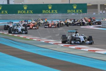 World © Octane Photographic Ltd. Sunday 23rd November 2014. Abu Dhabi Grand Prix - Yas Marina Circuit - Formula 1 Race. Mercedes AMG Petronas F1 W05 – Lewis Hamilton and Nico Rosberg lead the pack on the opening lap. Digital Ref:
