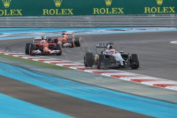 World © Octane Photographic Ltd. Sunday 23rd November 2014. Abu Dhabi Grand Prix - Yas Marina Circuit - Formula 1 Race. McLaren Mercedes MP4/29 - Jenson Button and Scuderia Ferrari F14T – Kimi Raikkonen and Fernando Alonso. Digital Ref: