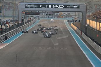 World © Octane Photographic Ltd. Sunday 23rd November 2014. Abu Dhabi Grand Prix - Yas Marina Circuit - Formula 1 Race. Mercedes AMG Petronas F1 W05 – Lewis Hamilton pulls away as Nico Rosberg gets a poor start and fights with the pack on the opening lap. Digital Ref: