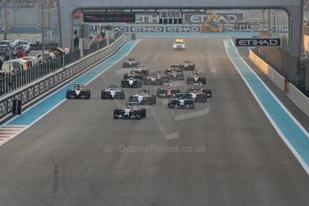 World © Octane Photographic Ltd. Sunday 23rd November 2014. Abu Dhabi Grand Prix - Yas Marina Circuit - Formula 1 Race. Mercedes AMG Petronas F1 W05 – Lewis Hamilton pulls away as Nico Rosberg gets a poor start and fights with the pack on the opening lap. Digital Ref: