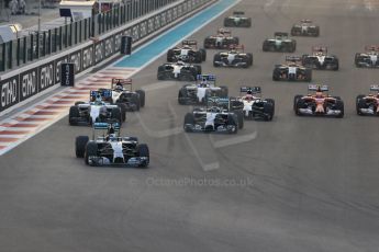 World © Octane Photographic Ltd. Sunday 23rd November 2014. Abu Dhabi Grand Prix - Yas Marina Circuit - Formula 1 Race. Mercedes AMG Petronas F1 W05 Hybrid – Lewis Hamilton pulls away as Nico Rosberg gets a poor start and fights with the pack on the opening lap as Alonso grabs a brake on his Ferrari to avoid Raikkonen. Digital Ref:
