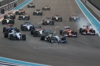 World © Octane Photographic Ltd. Sunday 23rd November 2014. Abu Dhabi Grand Prix - Yas Marina Circuit - Formula 1 Race. Mercedes AMG Petronas F1 W05 Hybrid – Nico Rosberg gets a poor start and fights with the pack on the opening lap as Alonso grabs a brake on his Ferrari to avoid Raikkonen. Digital Ref:
