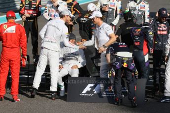 World © Octane Photographic Ltd. Sunday 23rd November 2014. Abu Dhabi Grand Prix - Yas Marina Circuit - End of season Formula 1 Drivers line up, Grosjean and Maldonado - Lotus F1 Team, Sutil, and Gutierrez - Sauber F1 Team, Stevens and Kobayashi - Caterham F1 Team, Button and Magnussen - McLaren Mercedes, Hulkenberg and Perez - Sahara Force India, Vergne and Kvyat - Toro Rosso, Alonso and Raikkonen - Scuderia Ferrari, Hamilton and Rosberg - Mercedes AMG Petronas, Vettel and Ricciardo - Infiniti Red Bull Racing and Massa and Bottas - Williams Racing. Digital Ref: