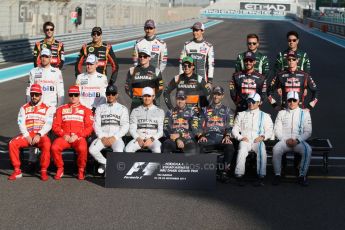 World © Octane Photographic Ltd. Sunday 23rd November 2014. Abu Dhabi Grand Prix - Yas Marina Circuit - End of season Formula 1 Drivers line up, Grosjean and Maldonado - Lotus F1 Team, Sutil, and Gutierrez - Sauber F1 Team, Stevens and Kobayashi - Caterham F1 Team, Button and Magnussen - McLaren Mercedes, Hulkenberg and Perez - Sahara Force India, Vergne and Kvyat - Toro Rosso, Alonso and Raikkonen - Scuderia Ferrari, Hamilton and Rosberg - Mercedes AMG Petronas, Vettel and Ricciardo - Infiniti Red Bull Racing and Massa and Bottas - Williams Racing. Digital Ref: