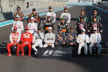 World © Octane Photographic Ltd. Sunday 23rd November 2014. Abu Dhabi Grand Prix - Yas Marina Circuit - End of season Formula 1 Drivers line up, Grosjean and Maldonado - Lotus F1 Team, Sutil, and Gutierrez - Sauber F1 Team, Stevens and Kobayashi - Caterham F1 Team, Button and Magnussen - McLaren Mercedes, Hulkenberg and Perez - Sahara Force India, Vergne and Kvyat - Toro Rosso, Alonso and Raikkonen - Scuderia Ferrari, Hamilton and Rosberg - Mercedes AMG Petronas, Vettel and Ricciardo - Infiniti Red Bull Racing and Massa and Bottas - Williams Racing. Digital Ref: