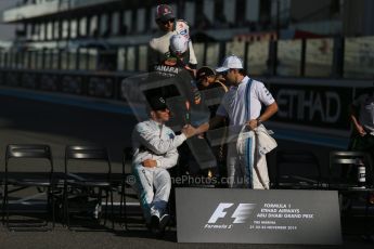 World © Octane Photographic Ltd. Sunday 23rd November 2014. Abu Dhabi Grand Prix - Yas Marina Circuit - End of season Formula 1 Drivers line up, Lewis Hamilton and Felipe Massa. Digital Ref: