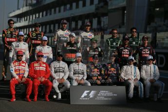 World © Octane Photographic Ltd. Sunday 23rd November 2014. Abu Dhabi Grand Prix - Yas Marina Circuit - End of season Formula 1 Drivers line up, Grosjean and Maldonado - Lotus F1 Team, Sutil, and Gutierrez - Sauber F1 Team, Stevens and Kobayashi - Caterham F1 Team, Button and Magnussen - McLaren Mercedes, Hulkenberg and Perez - Sahara Force India, Vergne and Kvyat - Toro Rosso, Alonso and Raikkonen - Scuderia Ferrari, Hamilton and Rosberg - Mercedes AMG Petronas, Vettel and Ricciardo - Infiniti Red Bull Racing and Massa and Bottas - Williams Racing. Digital Ref: