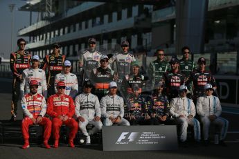 World © Octane Photographic Ltd. Sunday 23rd November 2014. Abu Dhabi Grand Prix - Yas Marina Circuit - End of season Formula 1 Drivers line up, Grosjean and Maldonado - Lotus F1 Team, Sutil, and Gutierrez - Sauber F1 Team, Stevens and Kobayashi - Caterham F1 Team, Button and Magnussen - McLaren Mercedes, Hulkenberg and Perez - Sahara Force India, Vergne and Kvyat - Toro Rosso, Alonso and Raikkonen - Scuderia Ferrari, Hamilton and Rosberg - Mercedes AMG Petronas, Vettel and Ricciardo - Infiniti Red Bull Racing and Massa and Bottas - Williams Racing. Digital Ref: