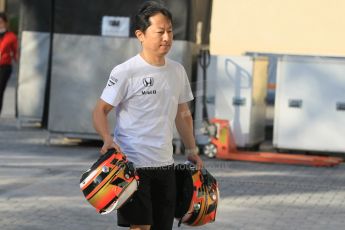 World © Octane Photographic Ltd. Tuesday 25th November 2014. Abu Dhabi Testing - Yas Marina Circuit. McLaren Honda - Stoffel Vandoorne's helmets are carried into the garage. Digital Ref: 1174CB1D1431