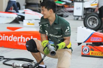 World © Octane Photographic Ltd. 2014 Formula 1 Abu Dhabi Grand Prix, GP2 setup, Thursday 20th November 2014. Rio Haryanto wheel change - EQ8 Caterham Racing. Digital Ref : 1156CB1D5207