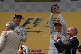 World © Octane Photographic Ltd. Sunday 22nd June 2014. Red Bull Ring, Spielberg - Austria - Formula 1 Podium. Mercedes AMG Petronas - Nico Rosberg and Williams Martini Racing - Valtteri Bottas. Digital Ref: 1001LB1D5855
