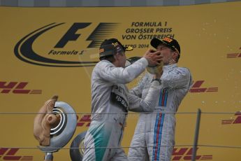 World © Octane Photographic Ltd. Sunday 22nd June 2014. Red Bull Ring, Spielberg - Austria - Formula 1 Podium. Mercedes AMG Petronas - Nico Rosberg and Williams Martini Racing - Valtteri Bottas. Digital Ref: 1001LB1D5890