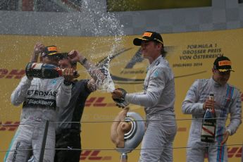 World © Octane Photographic Ltd. Sunday 22nd June 2014. Red Bull Ring, Spielberg - Austria - Formula 1 Podium. Mercedes AMG Petronas - Nico Rosberg and Lewis Hamilton plus Williams Martini Racing - Valtteri Bottas. Digital Ref: 1001LB1D5931