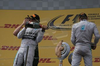 World © Octane Photographic Ltd. Sunday 22nd June 2014. Red Bull Ring, Spielberg - Austria - Formula 1 Podium. Mercedes AMG Petronas - Nico Rosberg and Lewis Hamilton. Digital Ref: 1001LB1D5935