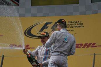 World © Octane Photographic Ltd. Sunday 22nd June 2014. Red Bull Ring, Spielberg - Austria - Formula 1 Podium. Mercedes AMG Petronas - Nico Rosberg and Williams Martini Racing - Valtteri Bottas. Digital Ref: 1001LB1D5955