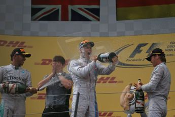 World © Octane Photographic Ltd. Sunday 22nd June 2014. Red Bull Ring, Spielberg - Austria - Formula 1 Podium. Mercedes AMG Petronas - Nico Rosberg and Lewis Hamilton plus Williams Martini Racing - Valtteri Bottas. Digital Ref: 1001LB1D5990