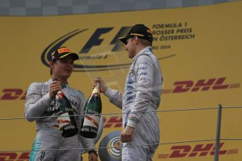 World © Octane Photographic Ltd. Sunday 22nd June 2014. Red Bull Ring, Spielberg - Austria - Formula 1 Podium. Mercedes AMG Petronas - Nico Rosberg and Williams Martini Racing - Valtteri Bottas. Digital Ref: 1001LB1D6018
