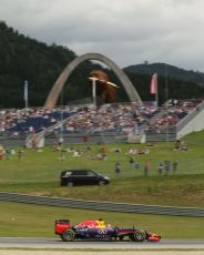 World © Octane Photographic Ltd. Saturday 21st June 2014. Red Bull Ring, Spielberg - Austria - Formula 1 Practice 3. Infiniti Red Bull Racing RB10 - Sebastian Vettel and media shuttle bus. Digital Ref: 0995LB1D1402