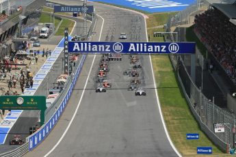 World © Octane Photographic Ltd. Sunday 22nd June 2014. Red Bull Ring, Spielberg - Austria - Formula 1 Race. The Williams Martini Racing FW36 of Felipe Massa leads the pack away on the opening lap. Digital Ref: 1000LB1D4996