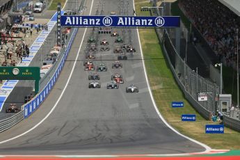 World © Octane Photographic Ltd. Sunday 22nd June 2014. Red Bull Ring, Spielberg - Austria - Formula 1 Race. The Williams Martini Racing FW36 of Felipe Massa leads the pack away on the opening lap as Rosberg's Mercedes dives past Bottas. Digital Ref: 1000LB1D5004