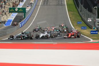 World © Octane Photographic Ltd. Sunday 22nd June 2014. Red Bull Ring, Spielberg - Austria - Formula 1 Race. The Mercedes AMG Petronas F1 W05 Hybrid of Nico Rosberg temporarily lead Bottas' Williams at turn 1 on the opening lap. Digital Ref: 1000LB1D5036