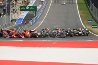 World © Octane Photographic Ltd. Sunday 22nd June 2014. Red Bull Ring, Spielberg - Austria - Formula 1 Race. Scuderia Ferrari F14T – Kimi Raikkonen, Sahara Force India VJM07 – Nico Hulkenburg and McLaren Mercedes MP4/29 - Jenson Button scrap away in the mid field. Digital Ref: 1000LB1D5050