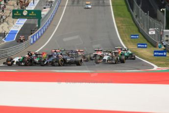 World © Octane Photographic Ltd. Sunday 22nd June 2014. Red Bull Ring, Spielberg - Austria - Formula 1 Race. Sahara Force India VJM07 – Nico Hulkenburg and McLaren Mercedes MP4/29 - Jenson Button scrap away in the mid field. Digital Ref: 1000LB1D5052