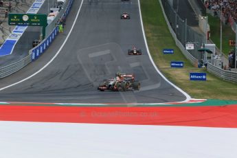 World © Octane Photographic Ltd. Sunday 22nd June 2014. Red Bull Ring, Spielberg - Austria - Formula 1 Race. Lotus F1 Team E22 - Romain Grosjean and Sauber C33 - Esteban Gutierrez. Digital Ref: 1000LB1D5332
