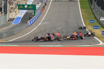 World © Octane Photographic Ltd. Sunday 22nd June 2014. Red Bull Ring, Spielberg - Austria - Formula 1 Race. Scuderia Toro Rosso STR 9 – Daniil Kvyat and Infiniti Red Bull Racing RB10 – Daniel Ricciardo. Digital Ref: 1000LB1D5366
