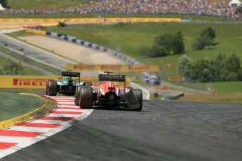 World © Octane Photographic Ltd. Sunday 22nd June 2014. Red Bull Ring, Spielberg - Austria - Formula 1 Race. Caterham F1 Team CT05 – Kamui Kobayashi and Marussia F1 Team MR03 - Jules Bianchi. Digital Ref: 1000LB1D5521