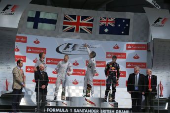 World © Octane Photographic Ltd. Saturday 5th July 2014. British GP, Silverstone, UK. - Formula 1 Podium. Mercedes AMG Petronas F1 W05 Hybrid – Lewis Hamilton (1st), Williams Martini Racing FW36 – Valtteri Bottas (2nd) and Infiniti Red Bull Racing RB10 – Daniel Ricciardo (3rd). Digital Ref: 1027LB1D1787