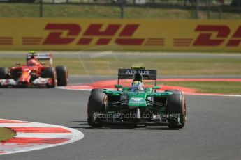 World © Octane Photographic Ltd. Friday 4th July 2014. British GP - Silverstone, UK. - Formula 1 Practice 1. Caterham F1 Team CT05 – Marcus Ericsson and Scuderia Ferrari F14T – Kimi Raikkonen. Digital Ref: 1011LB1D7335