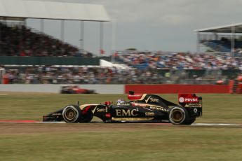 World © Octane Photographic Ltd. Friday 4th July 2014. British GP - Silverstone, UK. - Formula 1 Practice 2. Lotus F1 Team E22 - Romain Grosjean and Scuderia Ferrari F14T - Kimi Raikkonen. Digital Ref: 1013LB1D2720