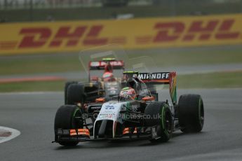 World © Octane Photographic Ltd. Saturday 5th July 2014. British GP, Silverstone, UK - Formula 1 Practice 3. Sahara Force India VJM07 – Sergio Perez and Lotus F1 Team E22 – Pastor Maldonado. Digital Ref: 1017LB1D9181