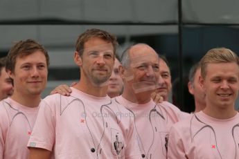 World © Octane Photographic Ltd. Saturday 5th July 2014. British GP, Silverstone, UK. - Formula 1 Paddock. Jenson Button, Kevin Magnussen, Ron Dennis and the McLaren team in their #Pinkforpapa shirts. Digital Ref: 1025LB1D0617