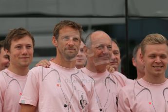 World © Octane Photographic Ltd. Saturday 5th July 2014. British GP, Silverstone, UK. - Formula 1 Paddock. Jenson Button, Kevin Magnussen, Ron Dennis and the McLaren team in their #Pinkforpapa shirts. Digital Ref: 1025LB1D0617