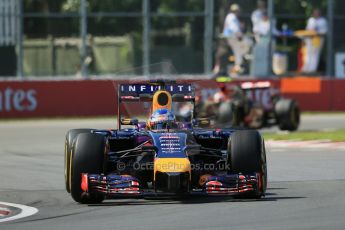 World © Octane Photographic Ltd. Friday 6th June 2014. Canada - Circuit Gilles Villeneuve, Montreal. Formula 1 Practice 2. Infiniti Red Bull Racing RB10 - Sebastian Vettel and Lotus F1 Team E22 – Pastor Maldonado. Digital Ref: 0979LB1D5023