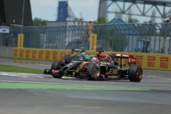 World © Octane Photographic Ltd. Saturday 7th June 2014. Canada - Circuit Gilles Villeneuve, Montreal. Formula 1 Qualifying. Lotus F1 Team E22 - Romain Grosjean and Caterham F1 Team CT05 – Marcus Ericsson. Digital Ref: 0983LB1D5966