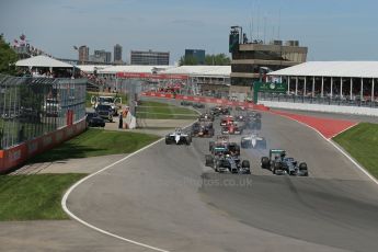 World © Octane Photographic Ltd. Sunday 8th June 2014. Canada - Circuit Gilles Villeneuve, Montreal. Formula 1 Race. Mercedes AMG Petronas F1 W05 Hybrid - Nico Rosberg leads race start. Digital Ref: 0986LB1D8143