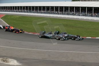 World © Octane Photographic Ltd. Sunday 8th June 2014. Canada - Circuit Gilles Villeneuve, Montreal. Formula 1 Race. Mercedes AMG Petronas F1 W05 Hybrid - Nico Rosberg leads race start as Lewis Hamilton moves beside him. Digital Ref: 0986LB1D8154