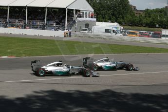 World © Octane Photographic Ltd. Sunday 8th June 2014. Canada - Circuit Gilles Villeneuve, Montreal. Formula 1 Race. Mercedes AMG Petronas F1 W05 Hybrid - Nico Rosberg leads race start as Lewis Hamilton moves beside him. Digital Ref: 0986LB1D8162