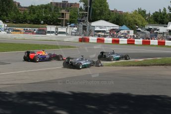 World © Octane Photographic Ltd. Sunday 8th June 2014. Canada - Circuit Gilles Villeneuve, Montreal. Formula 1 Race. Mercedes AMG Petronas F1 W05 Hybrid - Nico Rosberg leads race start as Lewis Hamilton moves beside him and runs wide. Digital Ref: 0986LB1D8170