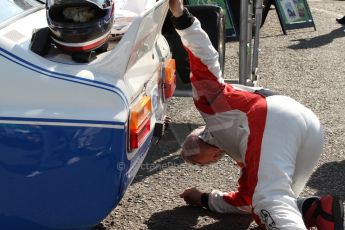 World © Octane Photographic Ltd. Donington Historic Festival, May 3rd 2014. Ford Capri RS3100, Steve Soper checks out the rear suspension. Digital Ref :